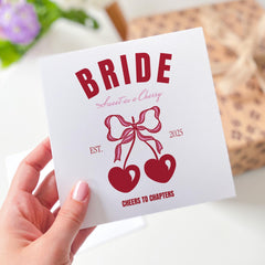 Retro Cherry Bride Design with Bows and Hearts Fun Hen Party or Bridal Celebration Card with “Cheers to Chapters” Quote Bride Card