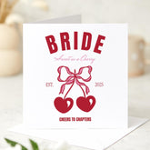 Retro Cherry Bride Design with Bows and Hearts Fun Hen Party or Bridal Celebration Card with “Cheers to Chapters” Quote Bride Card
