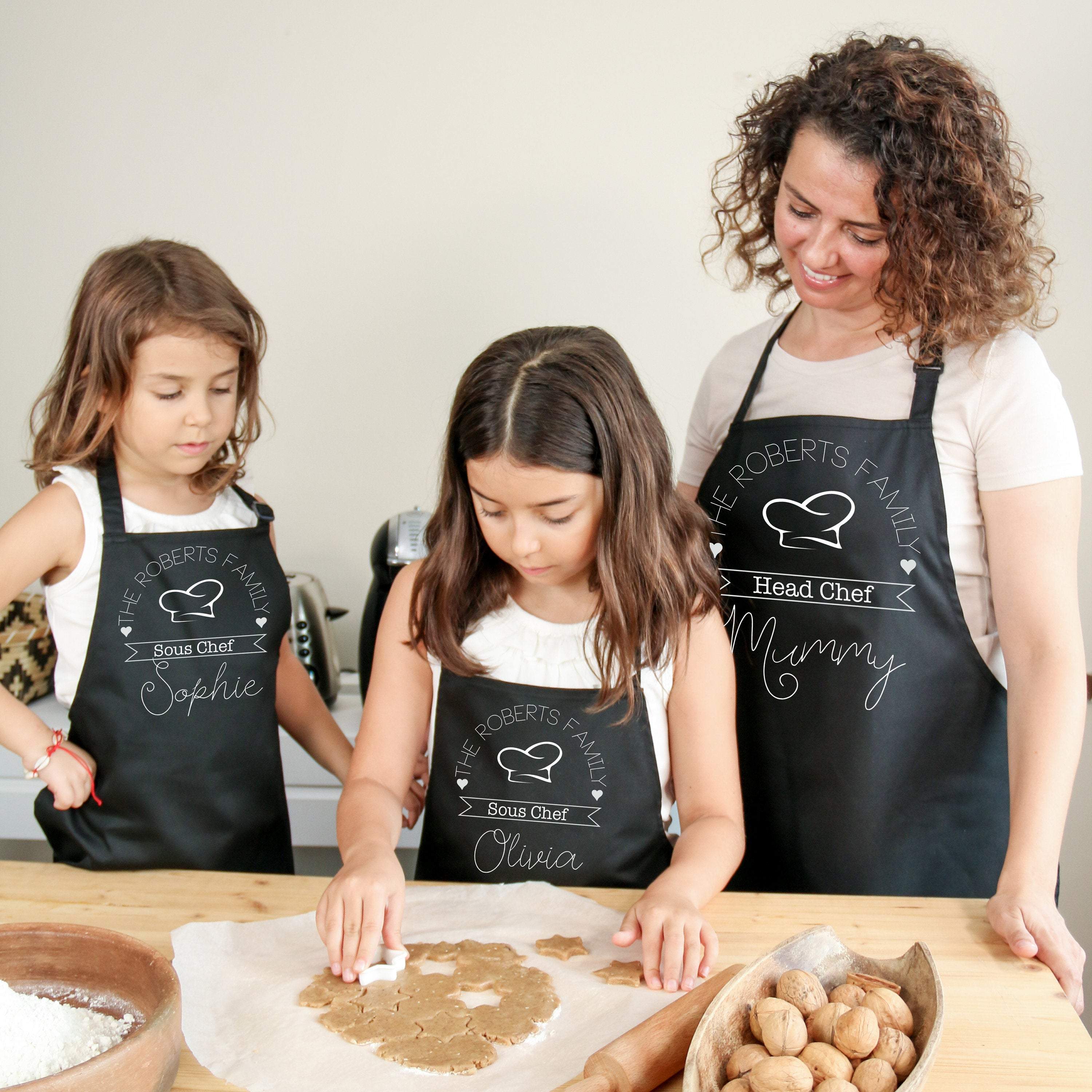 Matching head chef sous chef family aprons with names, Mum, dad, son and daughter aprons